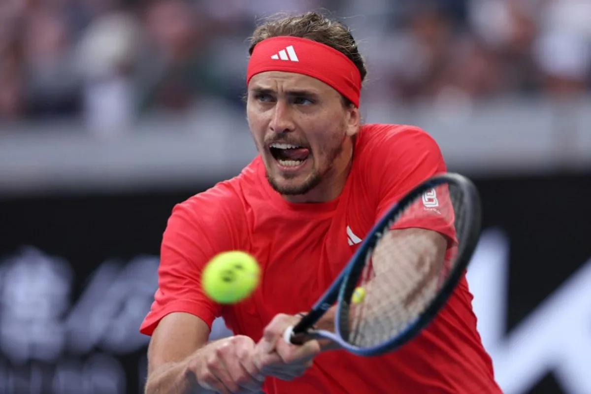 Germany's Alexander Zverev hits a return against France's Ugo Humbert during their men's singles match on day eight of the Australian Open tennis tournament in Melbourne on January 19, 2025.  Martin KEEP / AFP