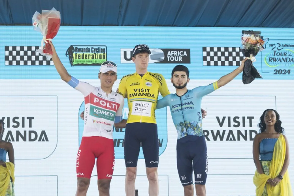 Winner Israel Premier Tech's British rider Joseph Blackmore, (M) Team Polti Kometa's Colombian rider Jhonatan Restrepo 2n (L) and Astana Qazaqstan Development Tea's KazakhstanI Ilkhan Dostiyev (R) are seen on the podium after the final stage of the 16th Tour du Rwanda 25 february 2024, in Kigali, Rwanda.   Guillem Sartorio / AFP