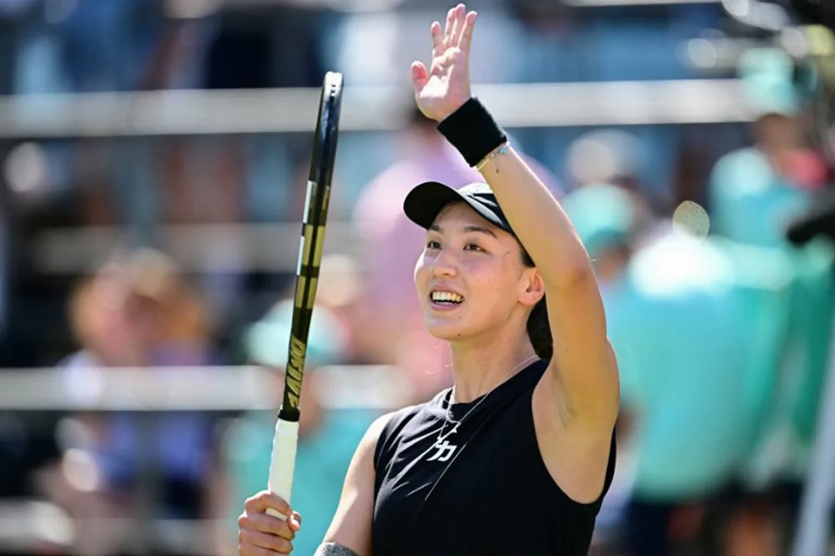 China's Wang Xinyu celebrates winning the semi-final match at the WTA tennis tournament in Berlin on June 21, 2025. Tobias SCHWARZ / AFP