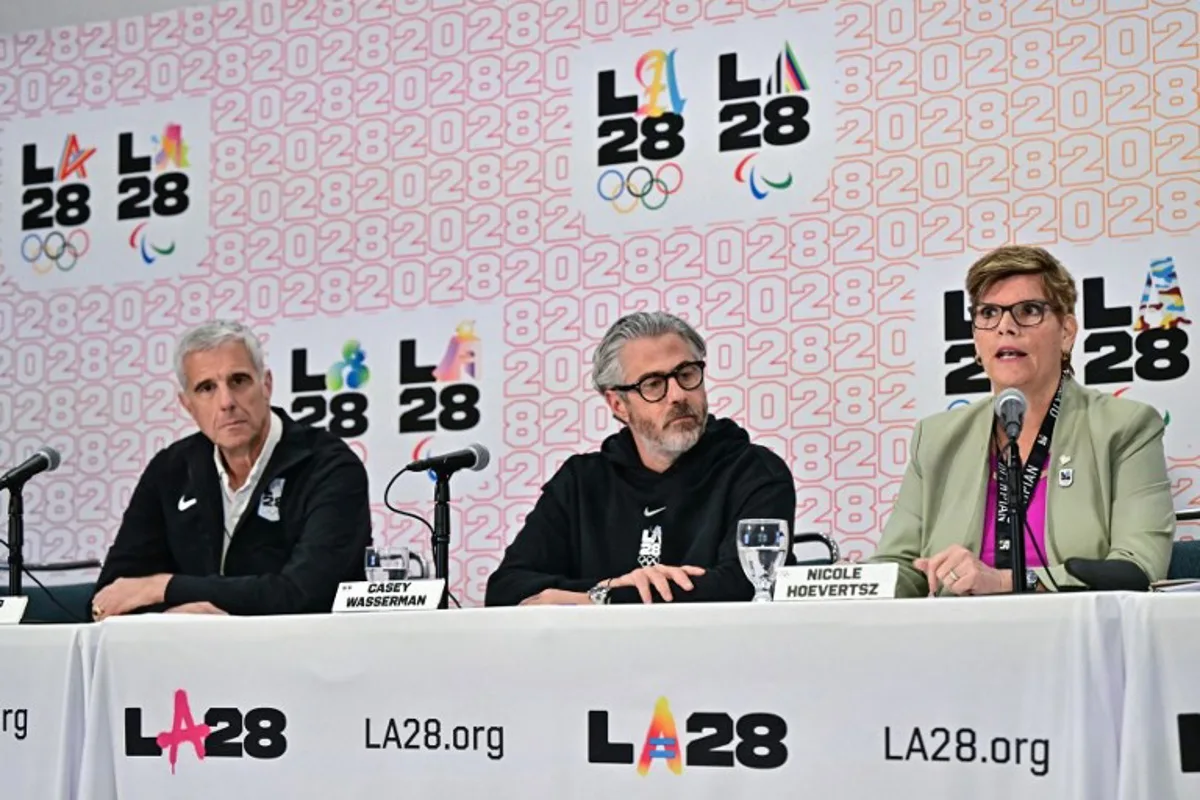 (L/R) LA28 CEO Reynold Hoover, LA28 Chairperson and President Casey Wasserman, and IOC Vice President and LA28 Coordination Commiussion chairperson Nicole Hoevertsz participate in a press conference with the International Olympic Committee (IOC) Coordination Commission for the Los Angeles 2028 Olympic and Paralympic Games, at the LA Convention Center in Los Angeles on June 5, 2025. Frederic J. Brown / AFP