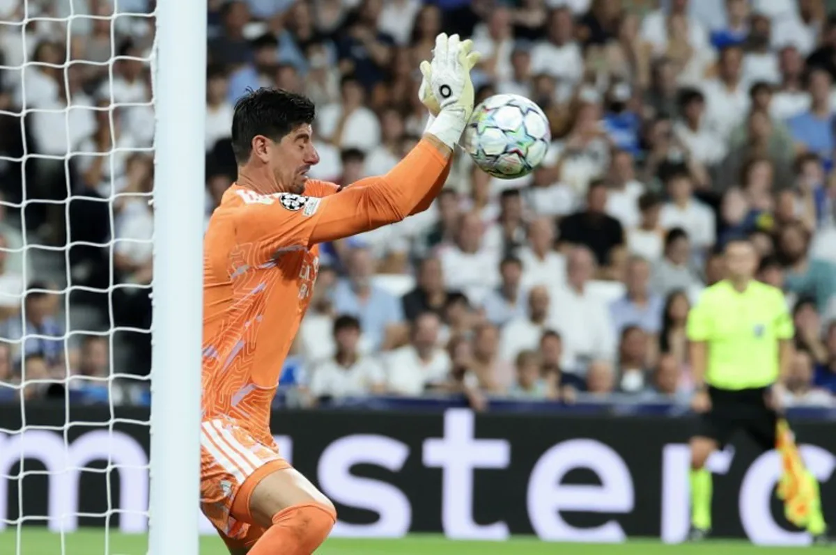 Real Madrid's Belgian goalkeeper #01 Thibaut Courtois makes a save during the UEFA Champions League first round day 1 football match between Real Madrid and Inter Milan at the Santiago Bernabeu stadium in Madrid on September 8, 2026.  Thomas COEX / AFP