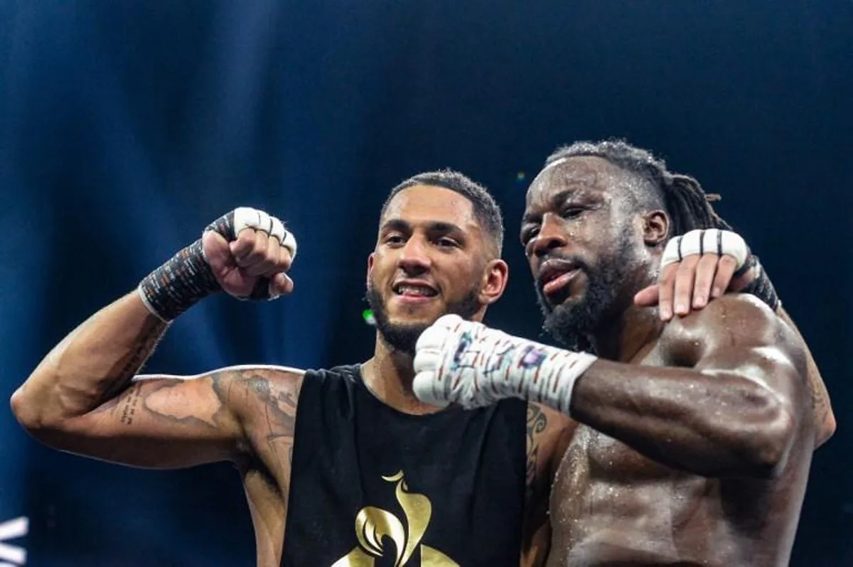 France's Tony Yoka (L) poses with Belgium's Joel Tambwe Djeko after winning their EBU European Union heavyweight title boxing match at the H Arena in Nantes, western France, on March 5, 2021. JEAN-FRANCOIS MONIER / AFP