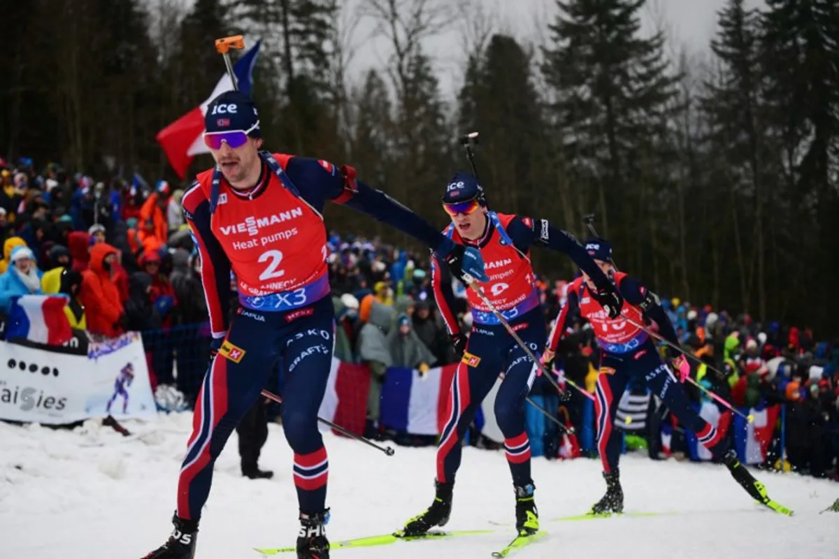 (From L) Norway's Sturla Laegreid, Norway's Tarjei Bo and Norway's Martin Uldal compete during the men's 15 km mass start event of the IBU Biathlon World Cup in Le Grand Bornand near Annecy, southeastern France, on December 22, 2024.     Olivier CHASSIGNOLE / AFP