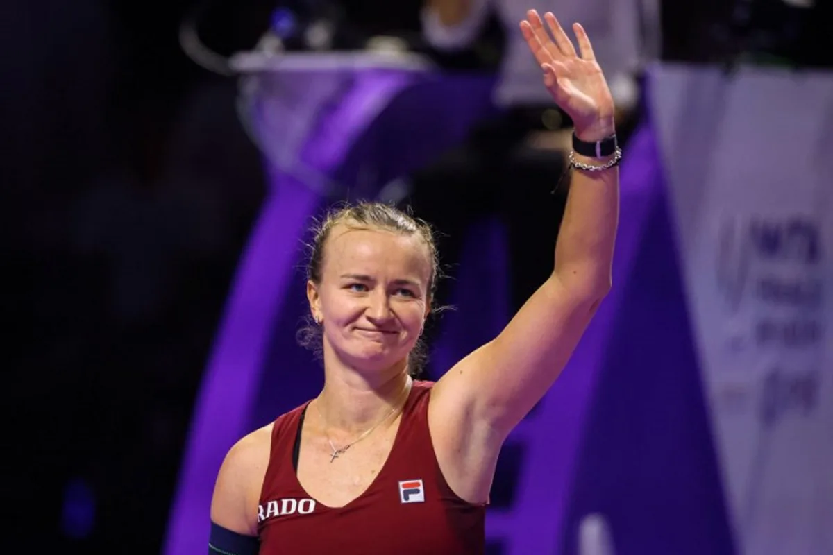 Czech Republic's Barbora Krejcikova greets supporters after her win against US' Jessica Pegula during their women's singles tennis match at the WTA Finals Championship in Riyadh on November 5, 2024.  Fayez NURELDINE / AFP