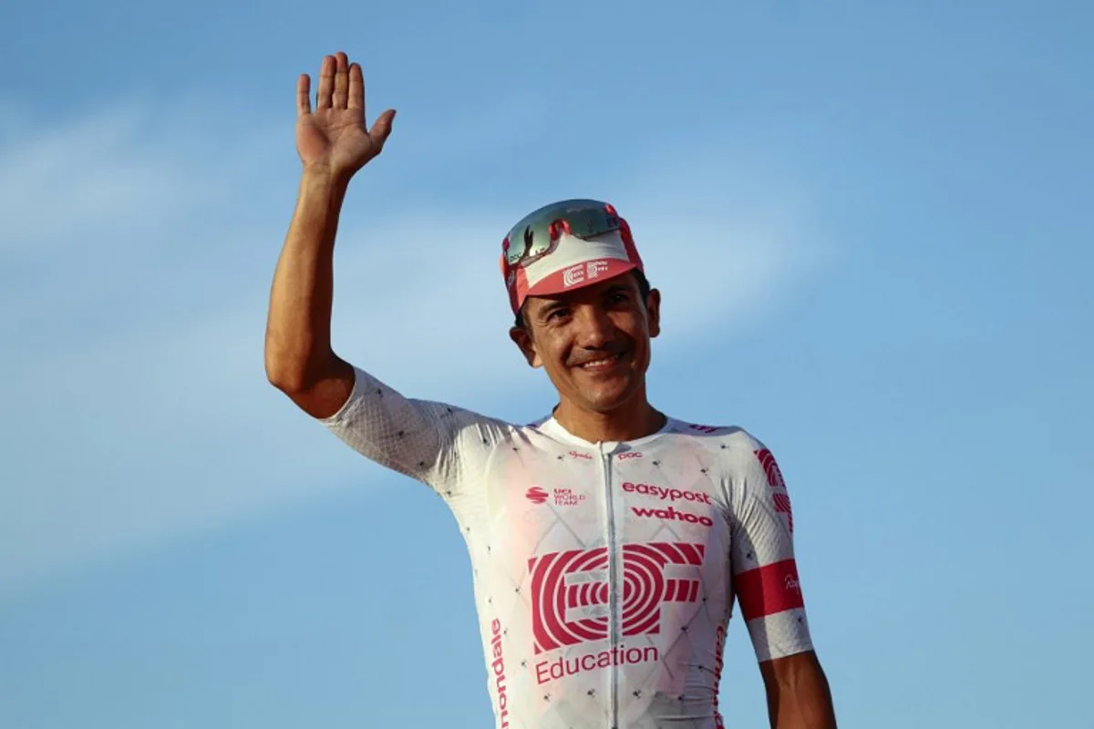 Third placed EasyPost's Ecuadorian rider Richard Carapaz celebrates on the podium after the 21st and last stage of the 108th Giro d'Italia cycling race of 143kms from Rome to Rome on June 1, 2025.  Luca Bettini / AFP