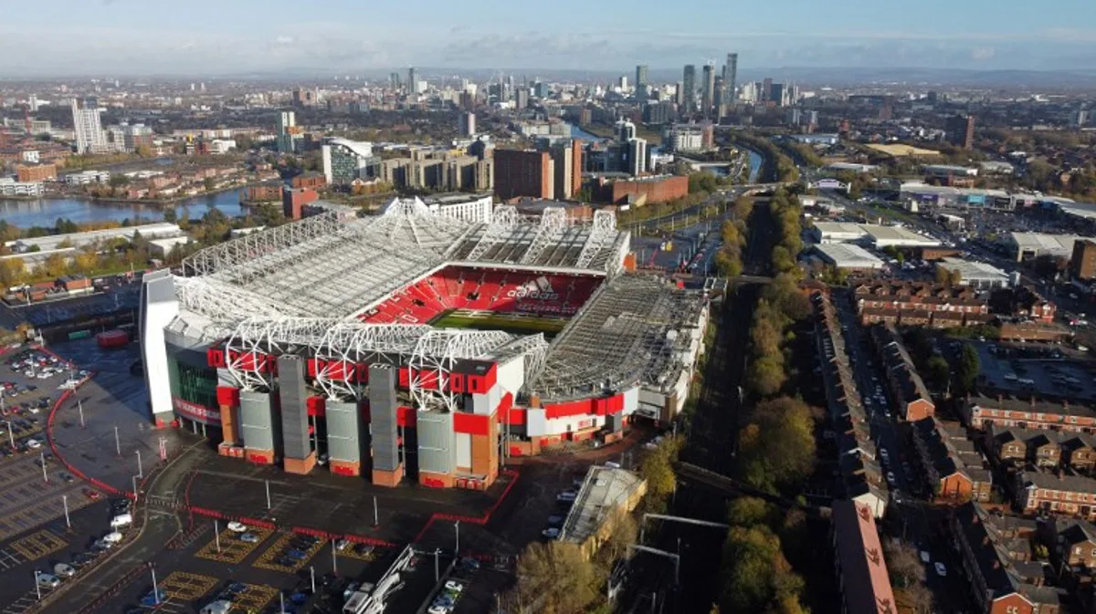 An aerial view shows Old Trafford stadium, home ground of to Manchester United football team, in Manchester, northern England, on November 23, 2022.  Manchester United's owners said Tuesday they were ready to sell the club after it was earlier confirmed star player Cristiano Ronaldo was leaving the Premier League giants. Weeks of turbulence at Old Trafford appeared to have come to an end when the club announced Ronaldo was leaving with "immediate effect". Oli SCARFF / AFP