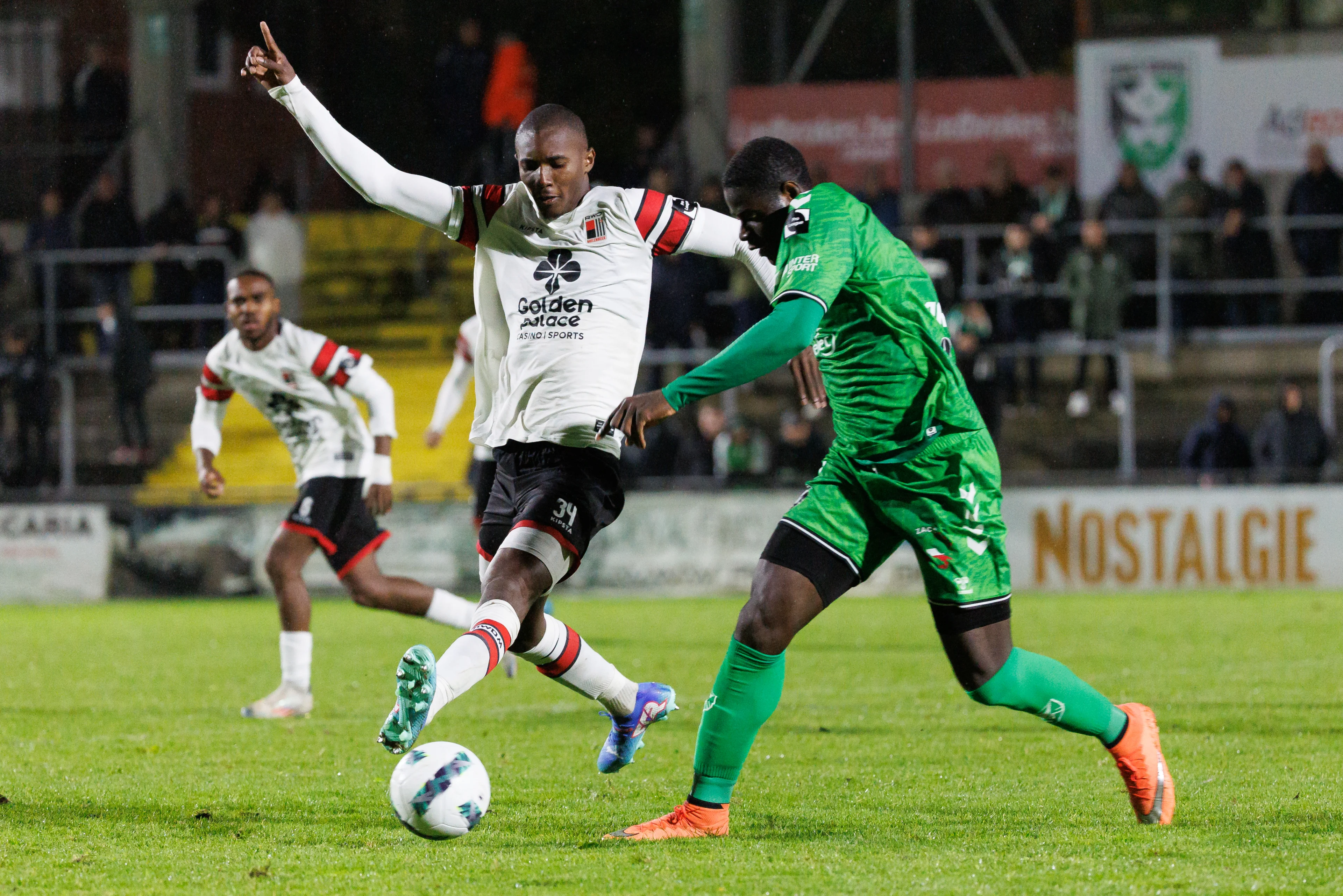 Rwdm's Christ Makosso and Francs Borains' Mondy Prunier fight for the ball during a soccer match between Royal Francs Borains and RWD Molenbeek, in Boussu, on day 6 of the 2024-2025 'Challenger Pro League' 1B second division of the Belgian championship, Friday 27 September 2024. BELGA PHOTO KURT DESPLENTER