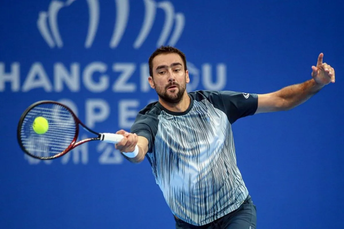 Croatia's Marin Cilic hits a return against USA's Brandon Nakashima during their men's singles semifinal match at the ATP Hangzhou Open tennis tournament in Hangzhou, in eastern China's Zhejiang province on September 23, 2024.  AFP