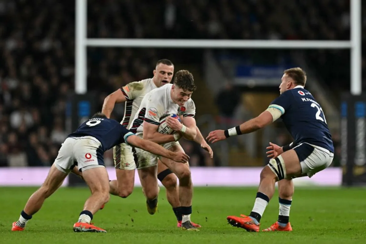 England's wing Tommy Freeman makes a break during the Six Nations international rugby union match between England and Scotland at the Allianz Stadium in Twickenham, south-west London on February 22, 2025.  Glyn KIRK / AFP