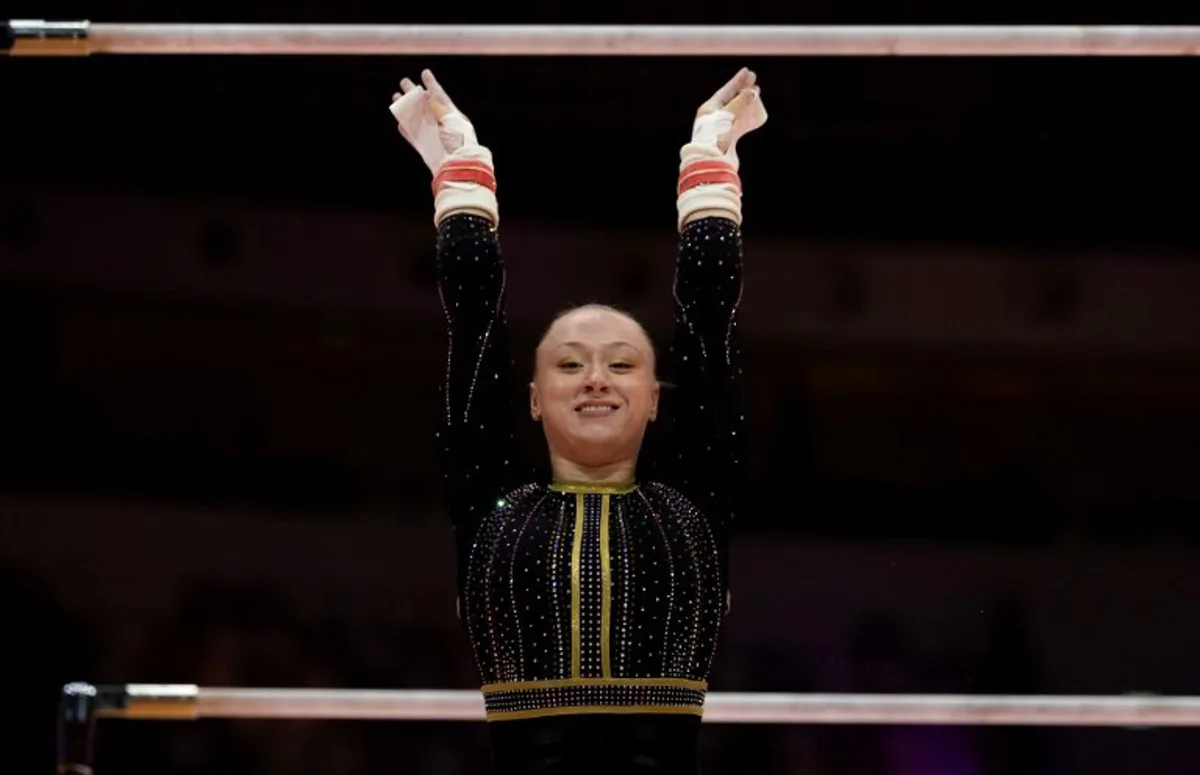 Belgium's Lisa Vaelen competes on the uneven bars during the women's qualifying session at the 53rd FIG Artistic Gymnastics World Championships in Jakarta on October 21, 2025. Yasuyoshi CHIBA / AFP
