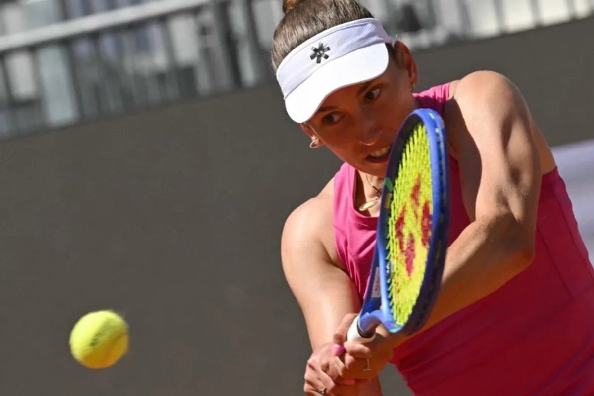 Belgium's Elise Mertens hits a return to Russia's Mira Andreeva during the WTA Rome Open tennis tournament at Foro Italico in Rome on May 11, 2026. Andreas SOLARO / AFP