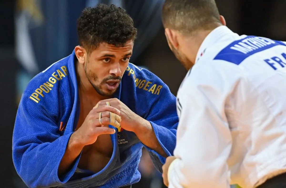 Belgium's Sami Chouchi (blue) and France's Alexis Mathieu compete in the men's -90 kg during the European Judo Championships 2023 at the Sud de France Arena in Montpellier, southern France, on November 5, 2023.  Sylvain THOMAS / AFP