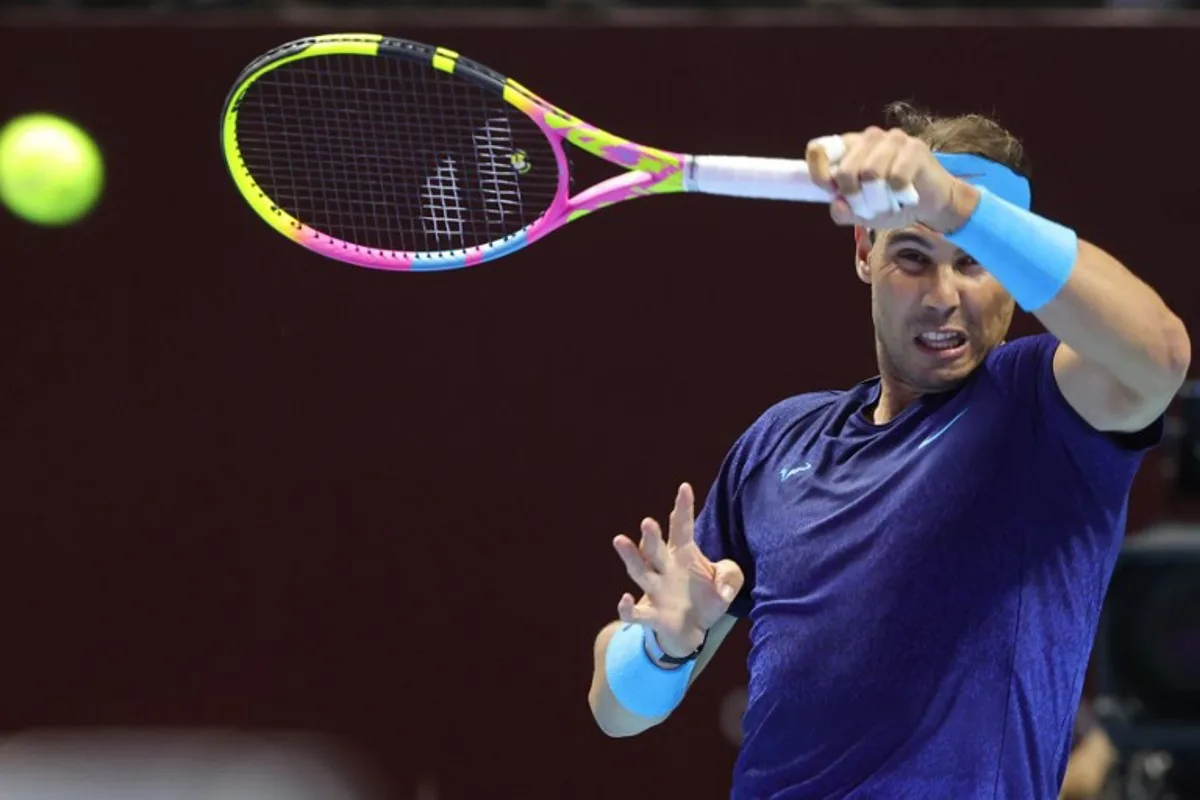 Spain's Rafael Nadal plays a return to Spain's Carlos Alcaraz during their semi-final tennis match in the "6 Kings Slam" exhibition tournament in Riyadh on October 17, 2024.  Fayez NURELDINE / AFP