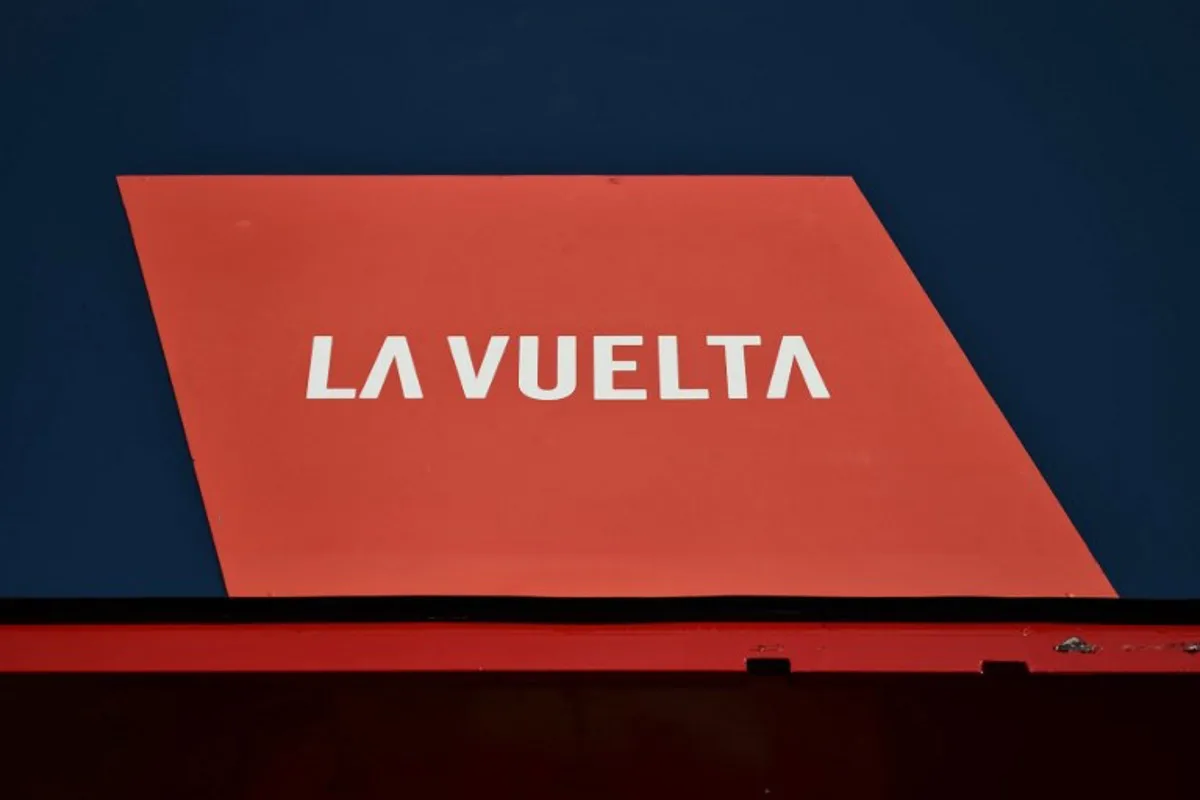 The logo of 'La Vuelta' cycling tour of Spain is pictured during the official teams presentation in Torino, Italy on August 21, 2025.  Marco BERTORELLO / AFP