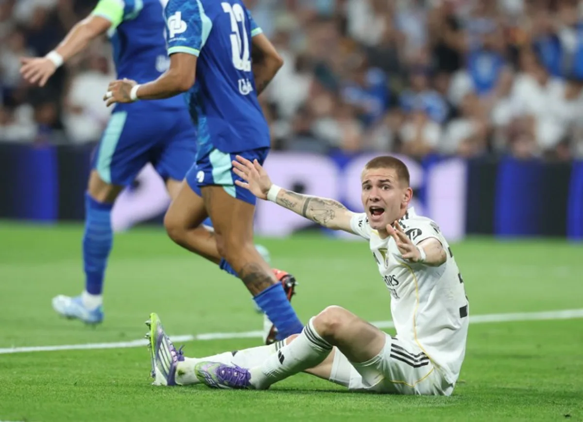 Real Madrid's Argentine forward #30 Franco Mastantuono reacts on the ground during the UEFA Champions League first round day 1 football match between Real Madrid CF and Olympique de Marseille at the Santiago Bernabeu stadium in Madrid on September 16, 2025. Pierre-Philippe MARCOU / AFP