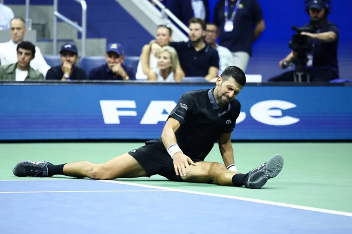 Serbia's Novak Djokovic reacts against Argentina's Mariano Navone during the men's singles first round tennis match on day one of the US Open tennis tournament at the USTA Billie Jean King National Tennis Center in New York City on August 30, 2026.  CHARLY TRIBALLEAU / AFP
