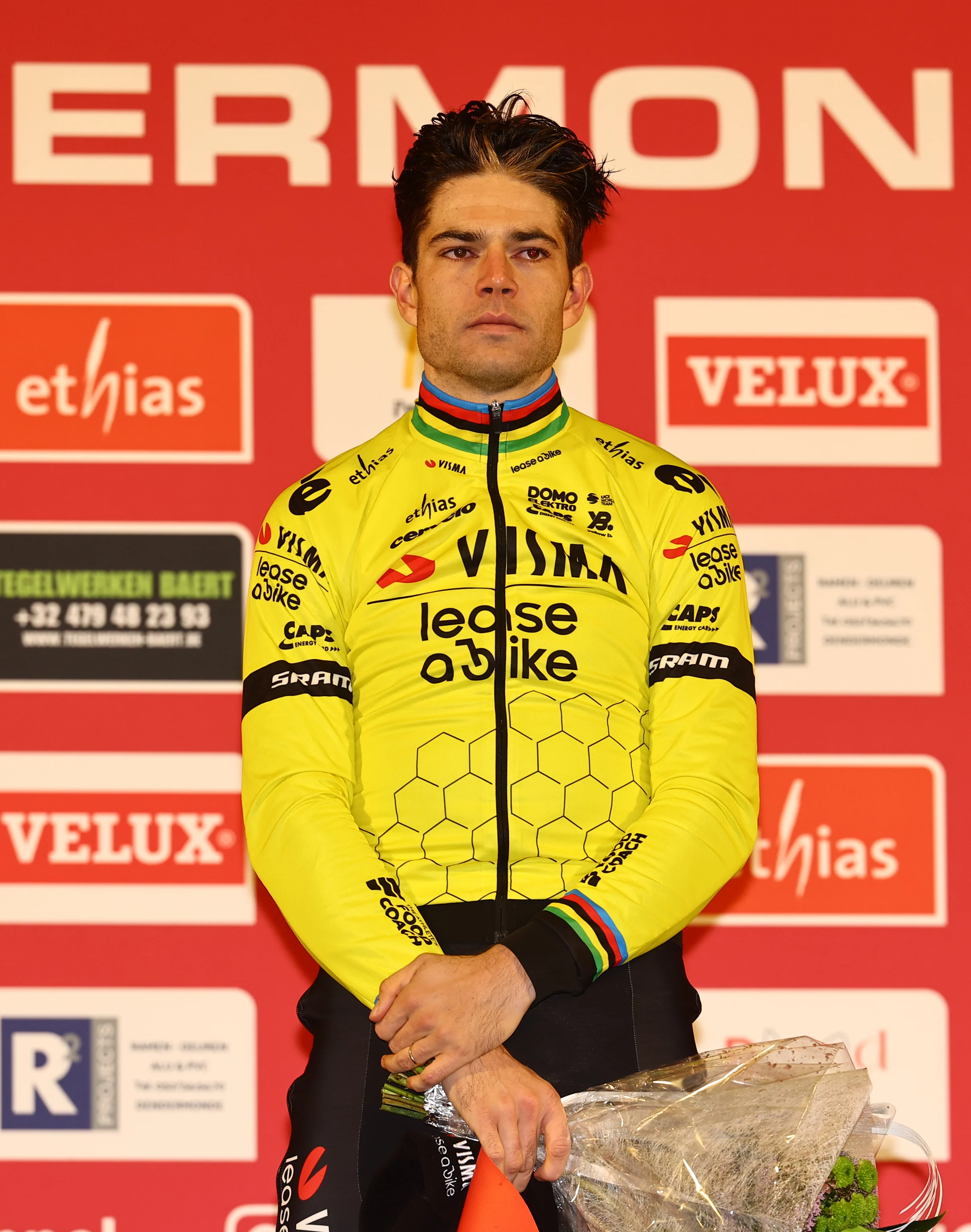 Belgian Wout van Aert celebrates on the podium as he won the men's elite race at the World Cup cyclocross cycling event in Dendermonde, Belgium, stage 9 (out of 12) of the UCI World Cup cyclocross competition, Sunday 05 January 2025. BELGA PHOTO DAVID PINTENS