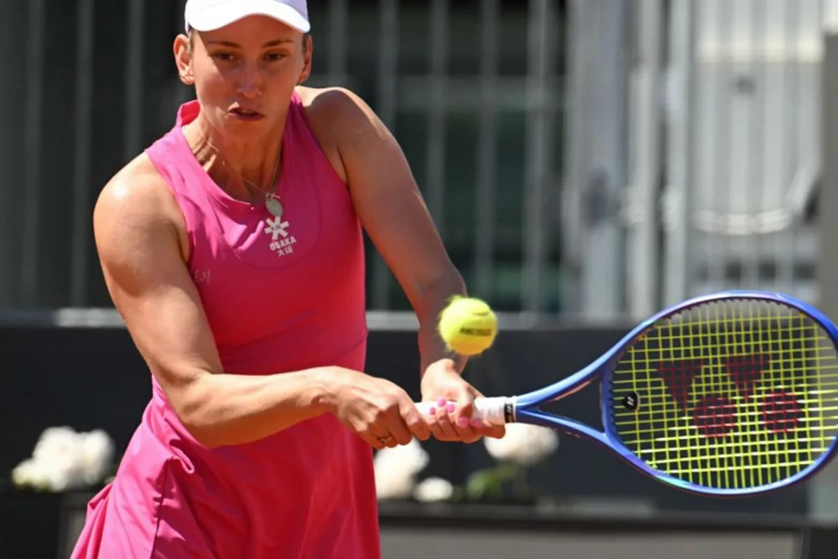 Belgium's Elise Mertens hits a return to Russia's Mira Andreeva during the WTA Rome Open tennis tournament at Foro Italico in Rome on May 11, 2026. Andreas SOLARO / AFP
