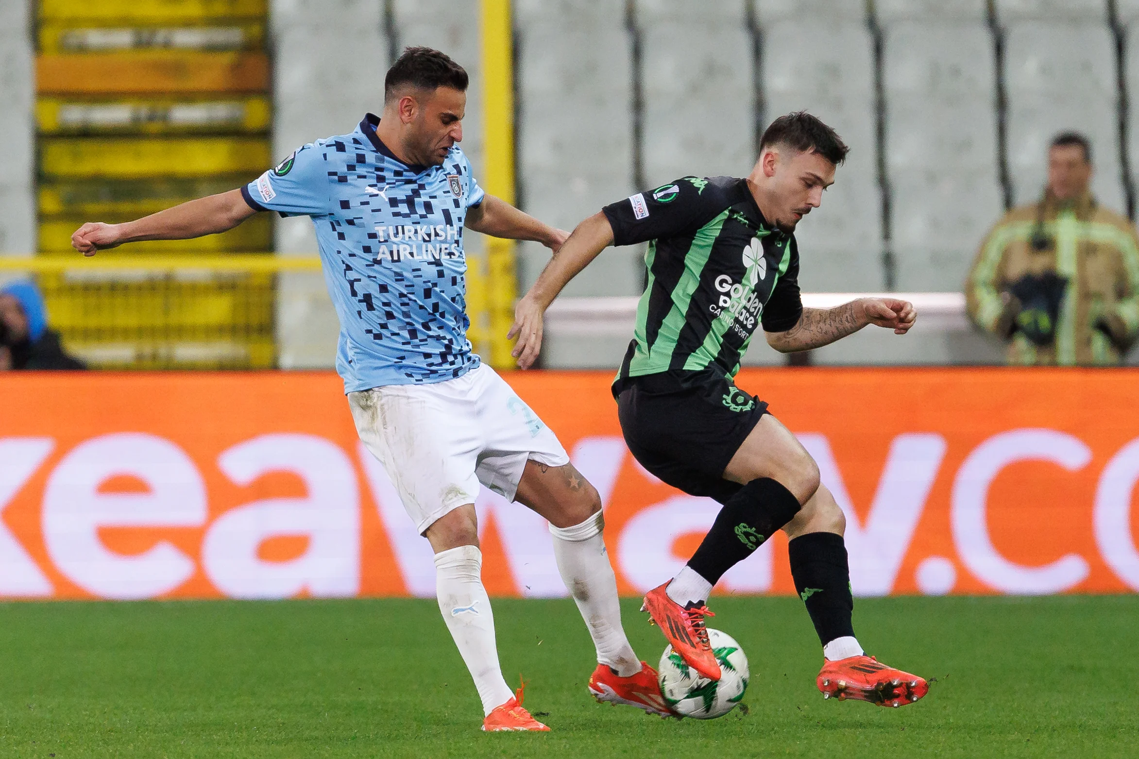 Basaksehir's Deniz Turuc and Cercle's Gary Magnee fight for the ball during a soccer game between Belgian Cercle Brugge KSV and Turkish Istanbul Basaksehir FK, Thursday 19 December 2024 in Brugge, on day 6/6 of the group stage of the UEFA Conference League tournament. BELGA PHOTO KURT DESPLENTER