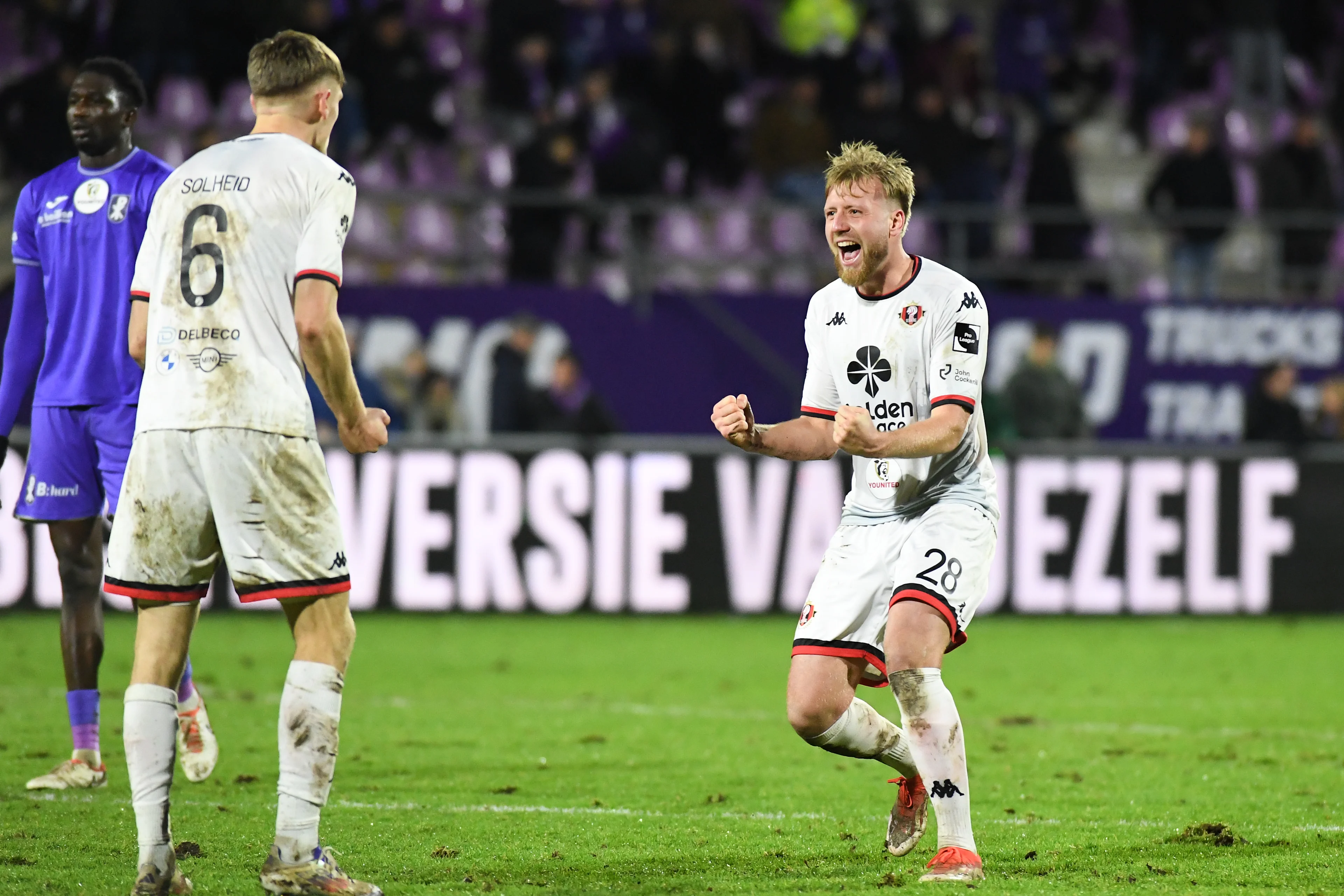 Seraing's Noah Solheid and Seraing's Ruben Droehnle celebrate after winning a soccer game between Patro Eisden and RFC Seraing, in Maasmechelen, on the day 16 of the 2024-2025 'Challenger Pro League' 1B second division of the Belgian championship, Sunday 22 December 2024. BELGA PHOTO JILL DELSAUX