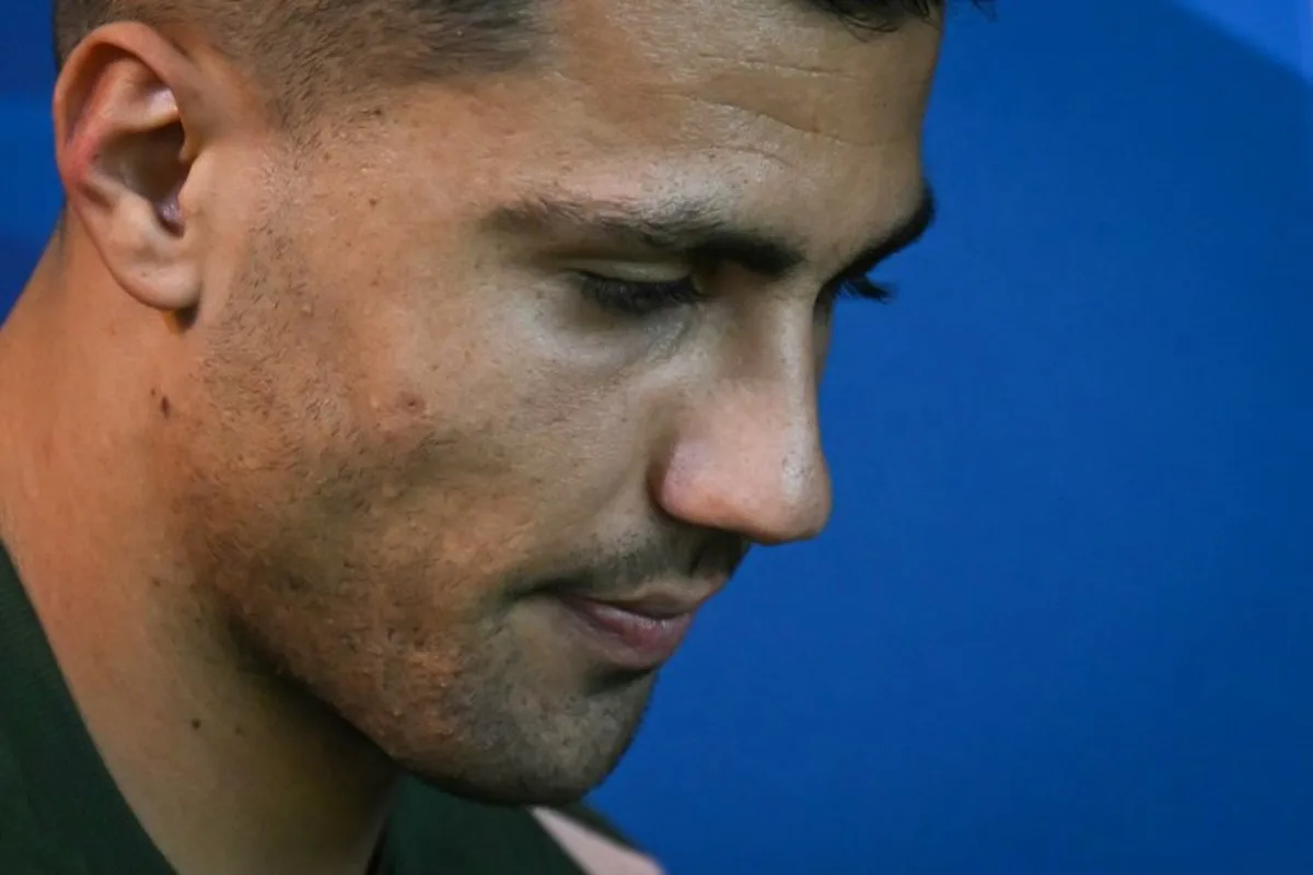 Manchester City's Spanish midfielder #16 Rodri arrives for a press conference at the Manchester City's training ground, in Manchester, north-west England, on September 17, 2024, on the eve of their UEFA Champions League football match against Inter Milan.   Oli SCARFF / AFP