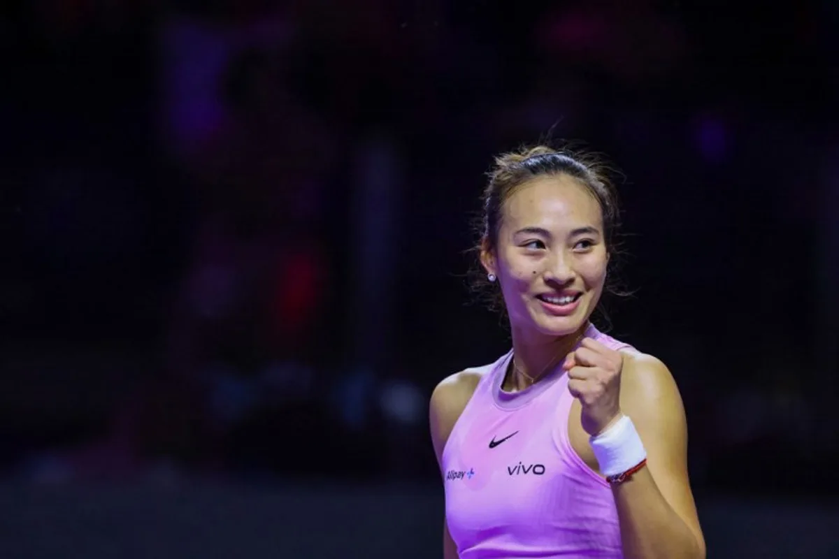 China's Qinwen Zheng celebrates after winning against Kazakhstan's Elena Rybakina during their women's singles tennis match at the WTA Finals Championship in Riyadh on November 4, 2024.  Fayez NURELDINE / AFP