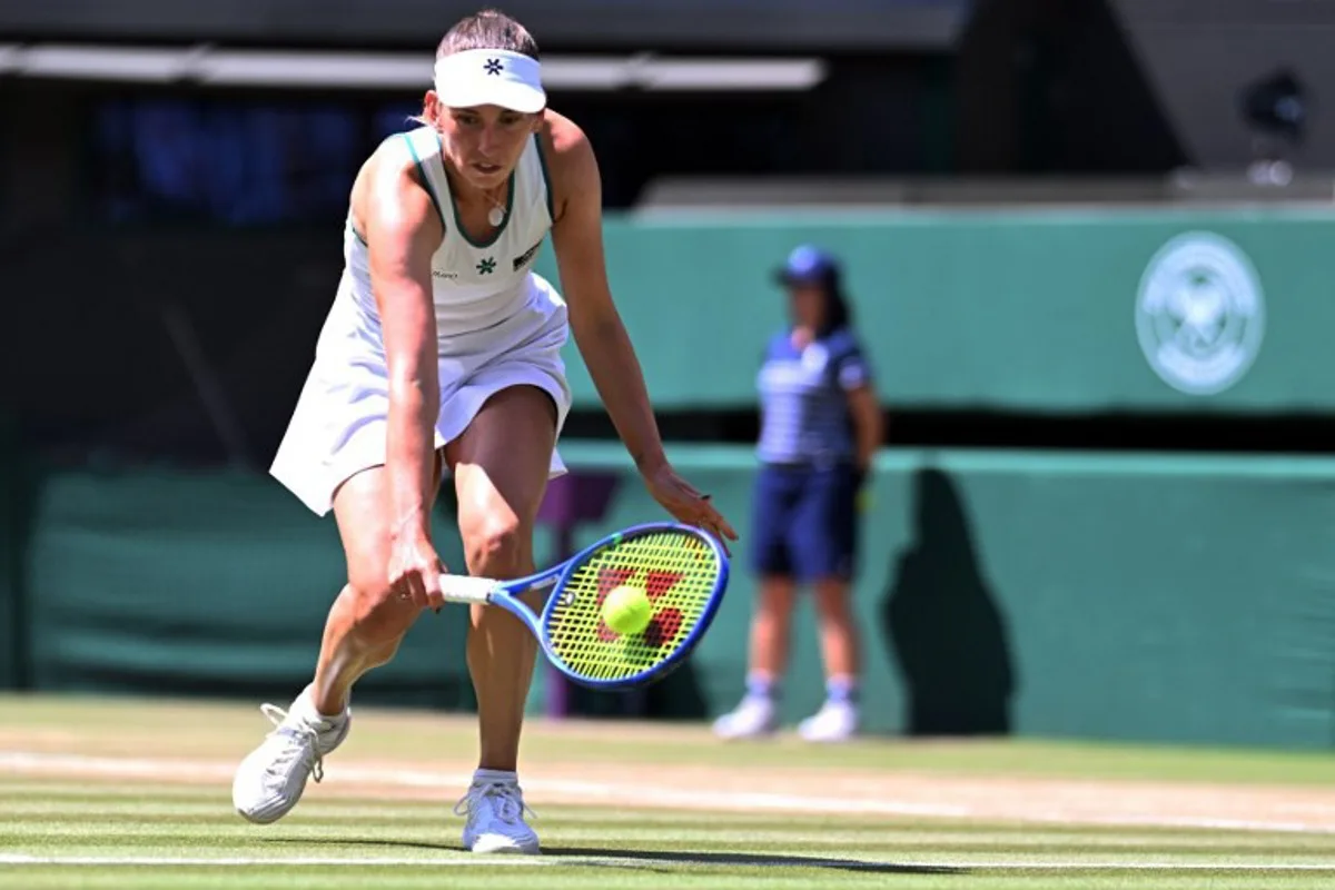 Belgium's Elise Mertens returns to Czech Republic's Linda Noskova during their women's singles quarter-final tennis match on the tenth day of the 2026 Wimbledon Championships at The All England Lawn Tennis and Croquet Club in Wimbledon, southwest London, on July 8, 2026. Kirill KUDRYAVTSEV / AFP