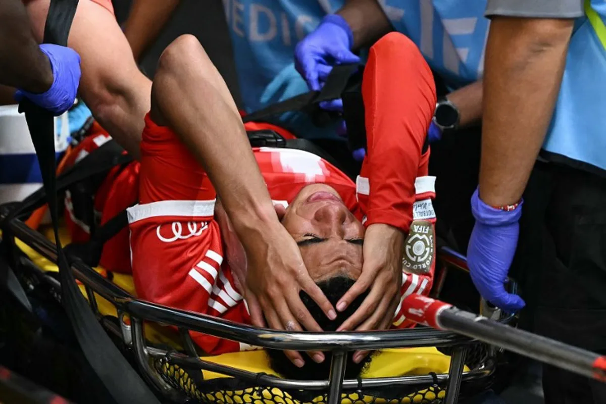 Bayern Munich's German midfielder #42 Jamal Musiala leaves the pitch on a stretcher during the FIFA Club World Cup 2025 quarterfinal football match between France's Paris Saint-Germain and Germany's Bayern Munich at the Mercedes-Benz Stadium in Atlanta on July 5, 2025. PATRICIA DE MELO MOREIRA / AFP