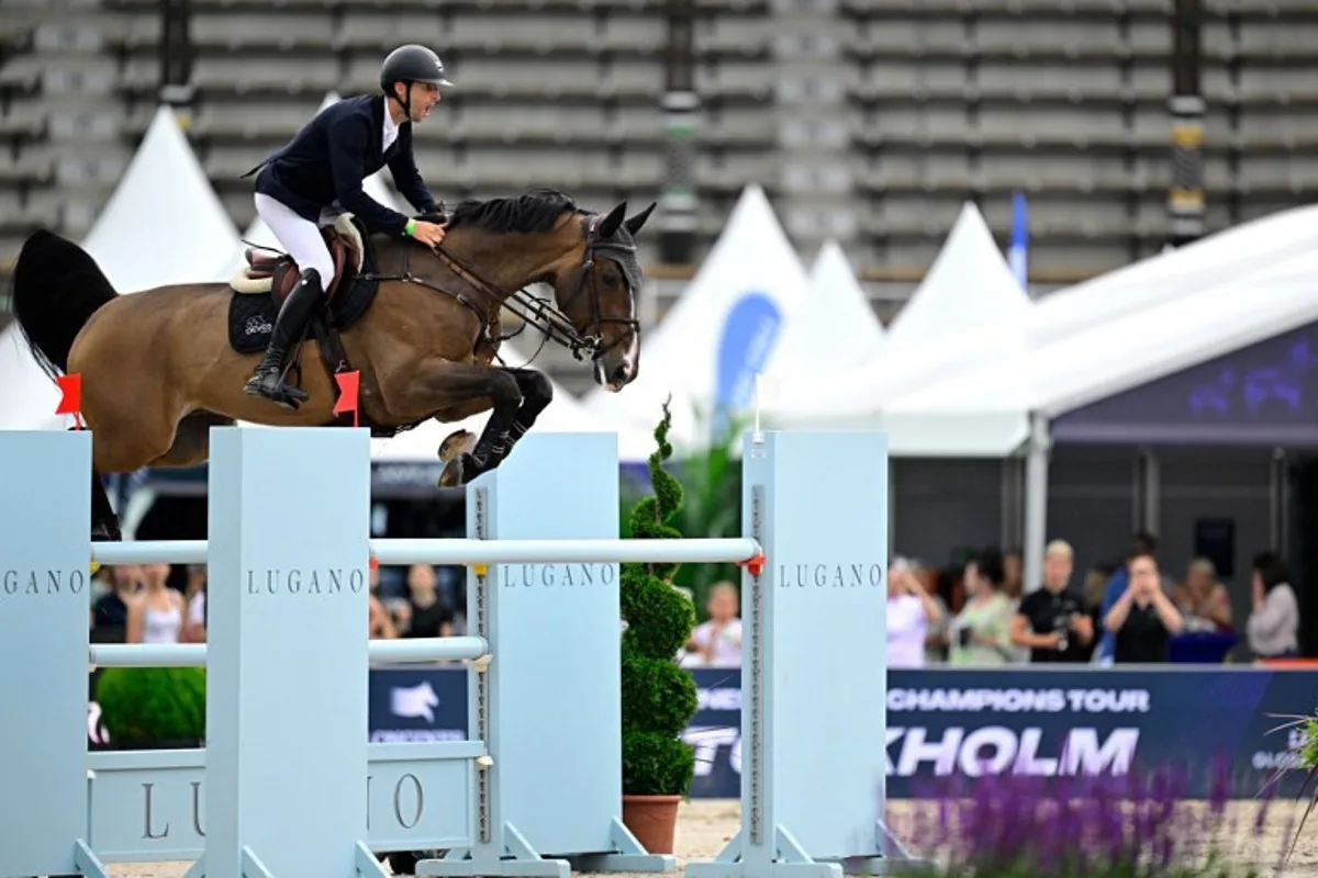 Belgium's Pieter Devos on the horse Nascar van 't Siamshof competes during the Global Champions League 1.55m Round 1 Team Competition of the Longines Global Champions Tour at Stockholm's historic Olympic Stadium, Sweden, on June 29, 2024.  Magnus LEJHALL / TT News Agency / AFP