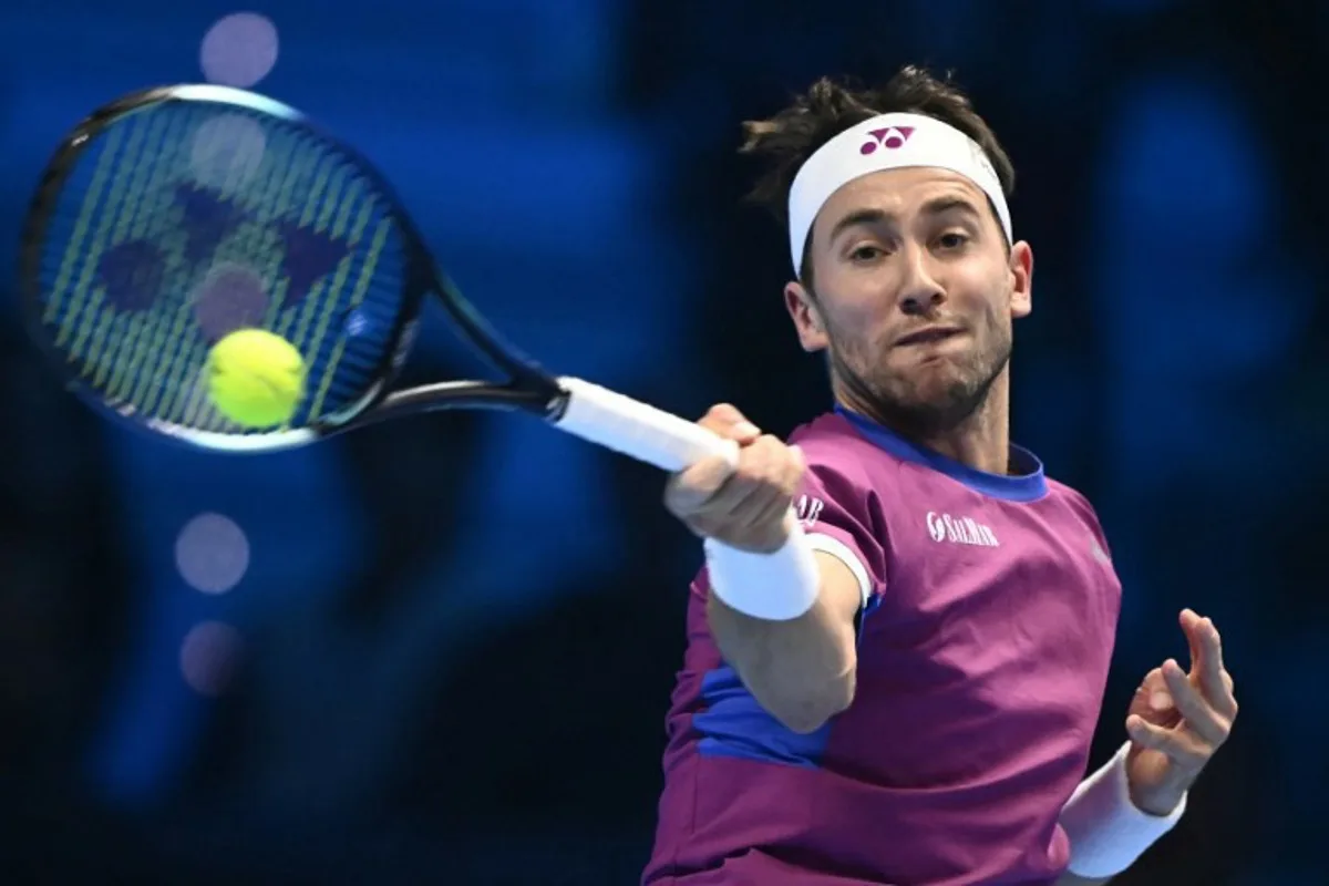 Norway's Casper Ruud hits a return to Russia's Andrey Rublev during their match at the ATP Finals tennis tournament in Turin on November 15, 2024.  Marco BERTORELLO / AFP