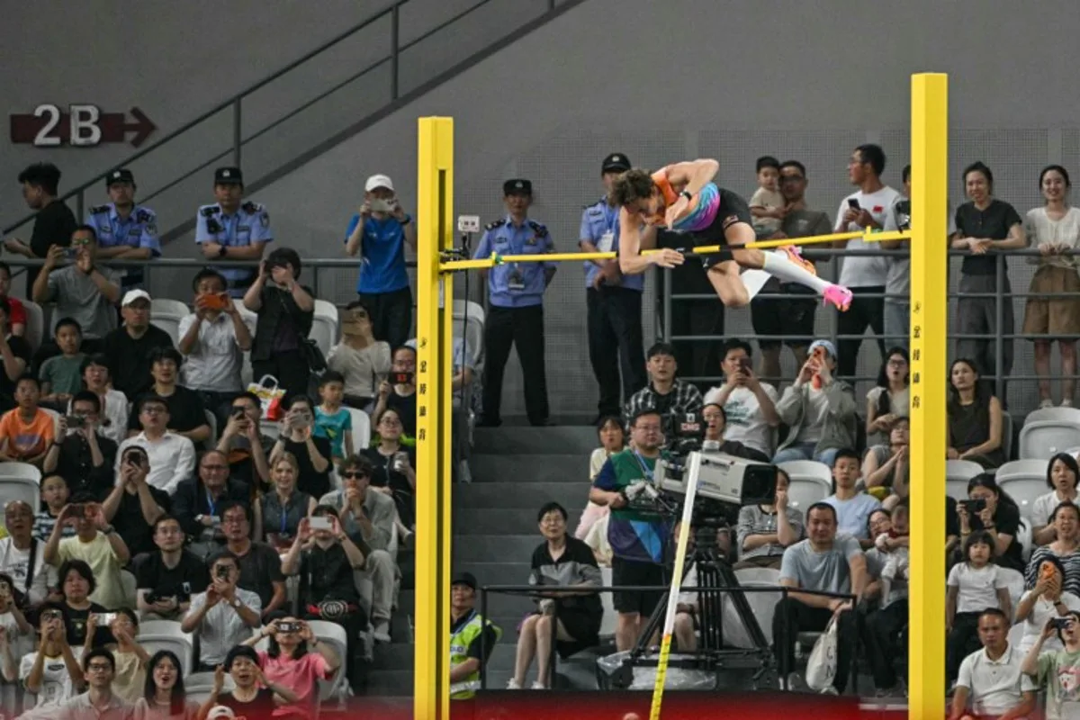 Sweden's Armand Duplantis competes in the men's pole vault event during the Shanghai/Keqiao Diamond League athletics meeting in Keqiao, Shaoxing in China's eastern Zhejiang province on May 16, 2026.  HECTOR RETAMAL / AFP