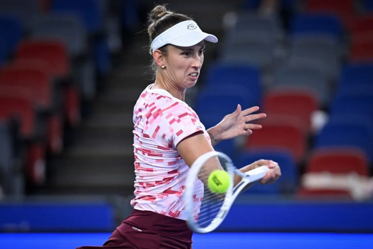 Belgium's Elise Mertens hits a return to Croatia's Donna Vekic during their women's singles match at the Wuhan Open tennis tournament in Wuhan, China's Hubei province on October 7, 2024.  WANG Zhao / AFP