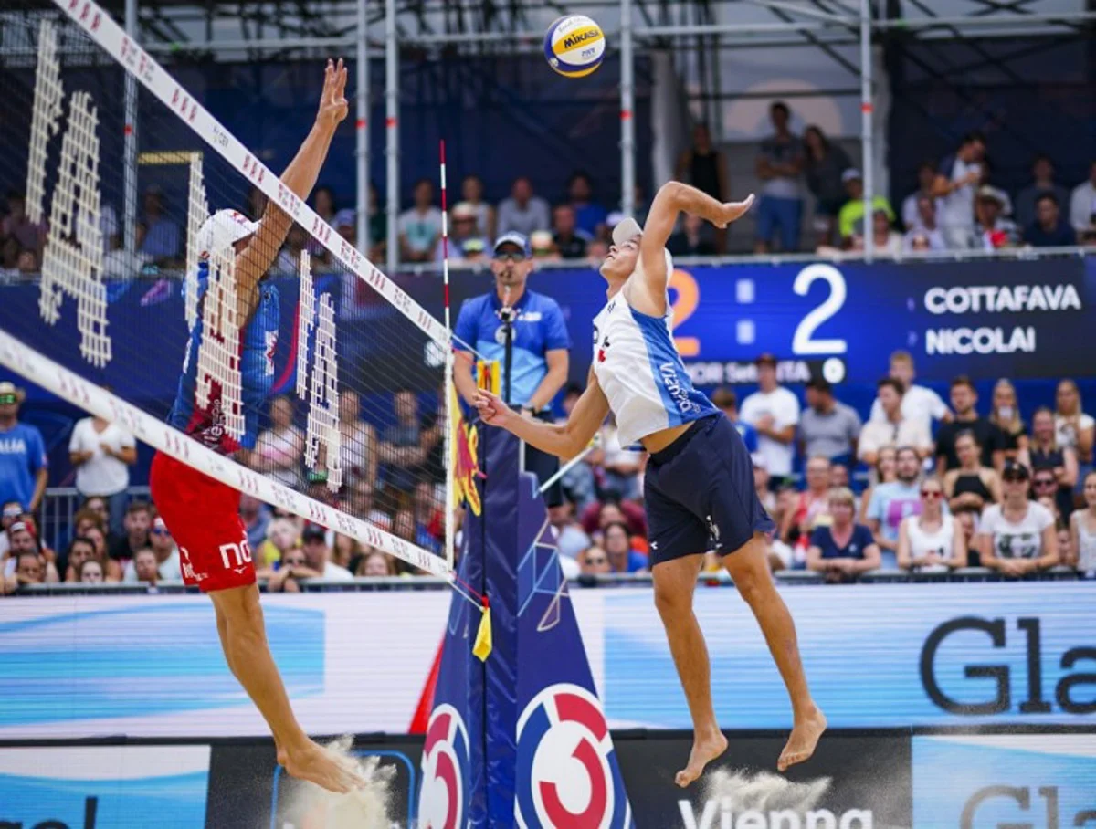 Norway's Christian Sorum and Anders Mol compete against Italy's Paolo Nicolai and Samuele Cottafava during the men's gold medal match of the BeachVolley Nations Cup between Italy and Norway in Vienna, Austria on August 7, 2022. Eva MANHART / APA / AFP