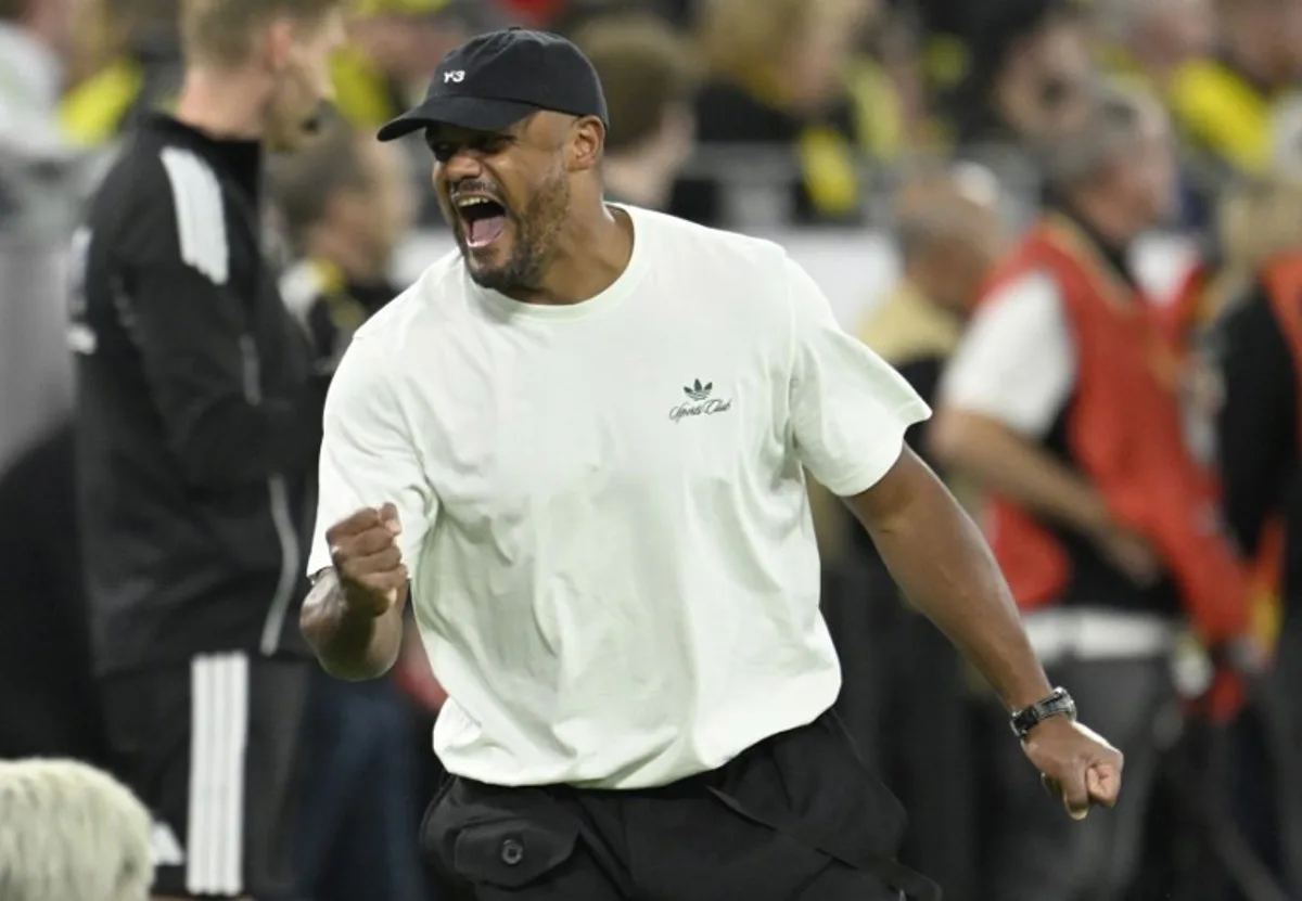 Bayern Munich's Belgian head coach Vincent Kompany celebrates after his team scored the 0-2 goal during the Franz Beckenbauer Supercup football match between Borussia Dortmund and FC Bayern Munich on August 22, 2026 in Dortmund, western Germany.  INA FASSBENDER / AFP