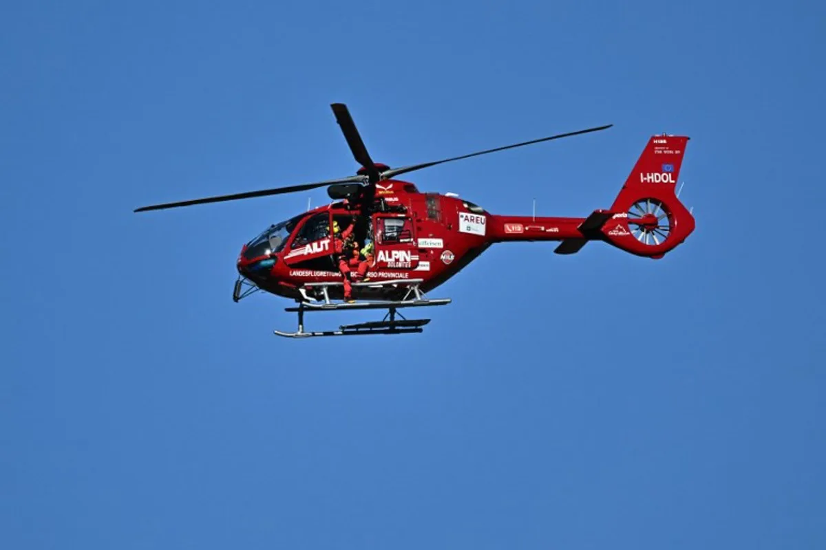 Switzerland's Gino Caviezel is airlifted by a medical helicopter after a fall during the Men's Super G race as part of the FIS Alpine Ski World Cup 2024-2025, in Bormio, Italy, on December 29, 2024.  Fabrice COFFRINI / AFP