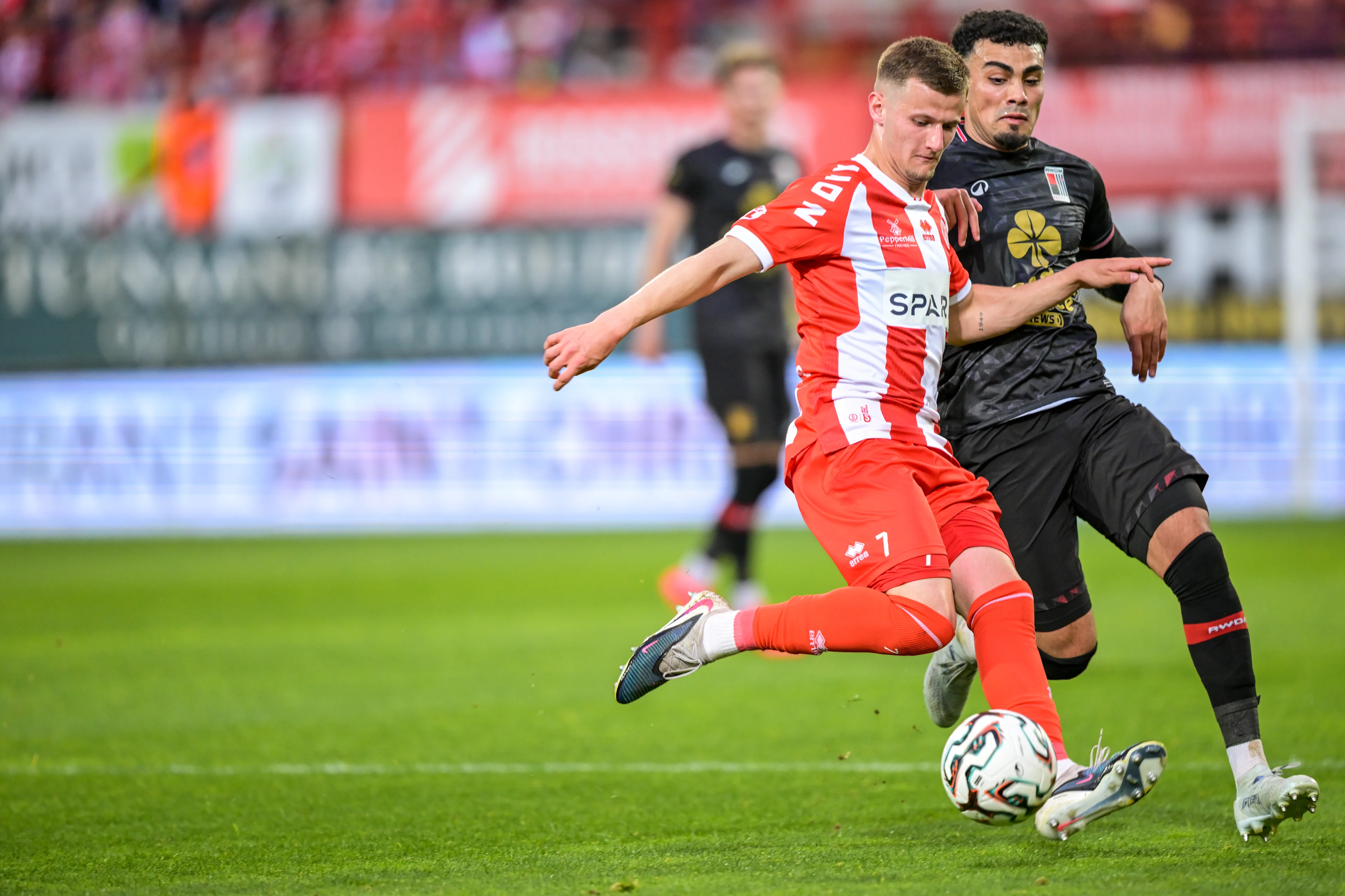 Kortrijk's Ilan Hurtevent and Rwdm's Ali Loune fight for the ball during a soccer game between KV Kortrijk and RWDM Brussels, Friday 17 April 2026 in Kortrijk, on day 34 of the 2025-2026 'Challenger Pro League' 1B second division of the Belgian championship. BELGA PHOTO DAVID PINTENS