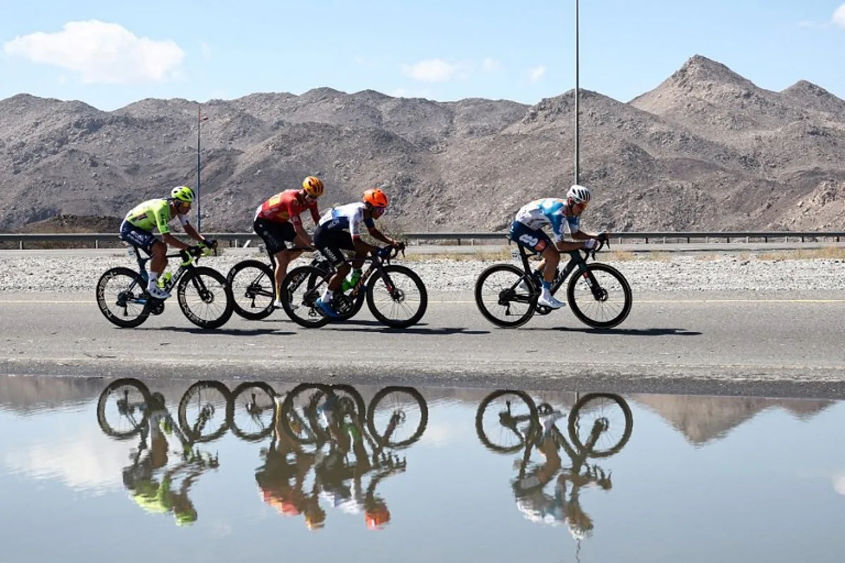 Netherlands' Huub Artz (Intermarche Wanty), Norway's Tord Gudmestad (Uno-X Mobility), Mongolia's Tegshbayar Batsaikhan (Roojai insurance), and Denmark's Lund Tobias Andresen (Team DSM-Firmenich POSTNL) ride during the fifth stage the of the Tour of Oman cycling race, at Jabal al-Akhdhar (Green Mountain), on February 14, 2024.  Anne-Christine POUJOULAT / AFP