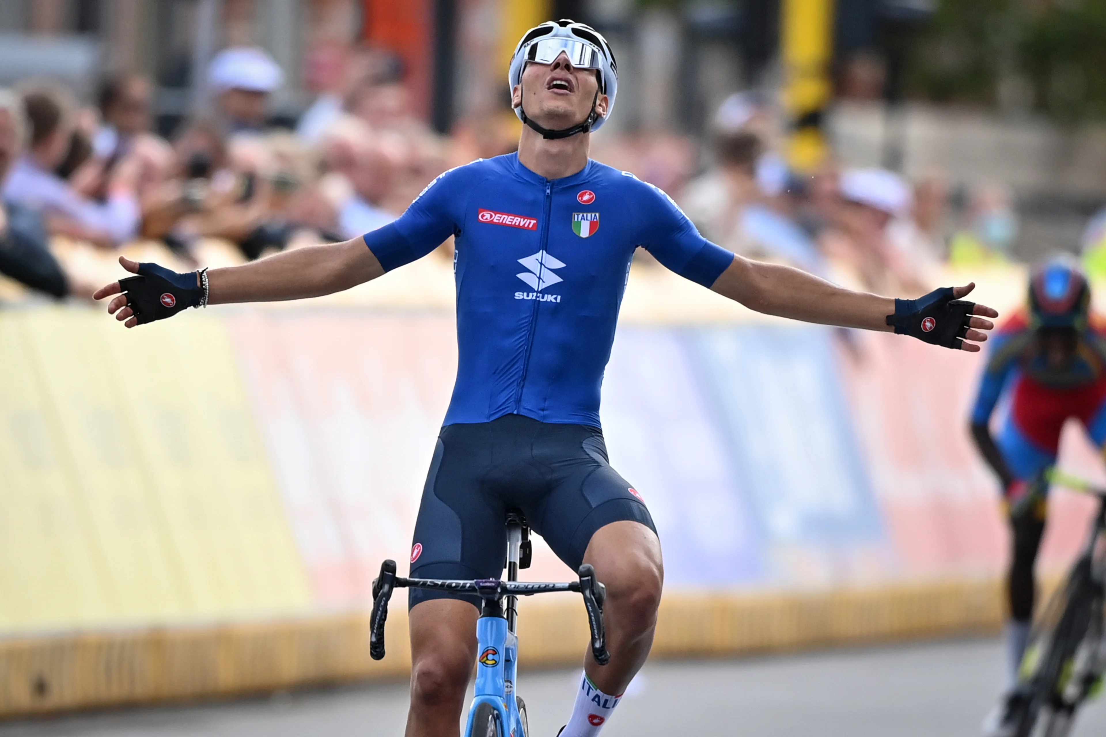 Italian Filippo Baroncini celebrates as he crosses the finish line to win the men U23 road race on the sixth day of the UCI World Championships Road Cycling Flanders 2021, 160,90km from Antwerp to Leuven, on Friday 24 September 2021. The Worlds take place from 19 to 26 September 2021, in several cities in Flanders, Belgium. BELGA PHOTO DAVID STOCKMAN