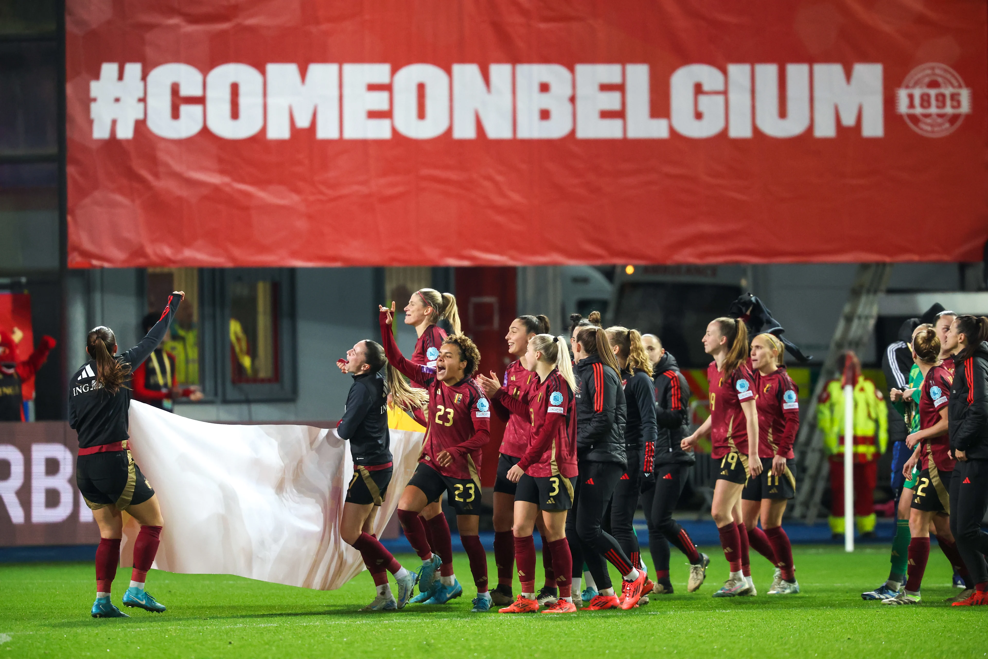 Players celebrate securing qualification, after a soccer game between Belgium's national team the Red Flames and Ukraine, in Heverlee, Tuesday 03 December 2024, the second leg of the second round of qualifications group stage for the Euro 2025 Championship. BELGA PHOTO VIRGINIE LEFOUR