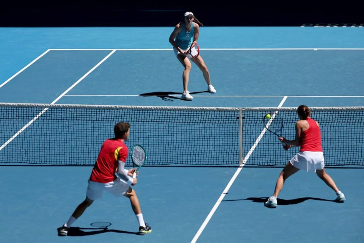 Spain's Pablo Carreno Busta and Yvonne Cavalle-Reimers hit a return to Kazakhstan's Elena Rybakina and Alexander Shevchenko during their mix doubles match at the United Cup tennis tournament in Perth on December 27, 2024.  COLIN MURTY / AFP