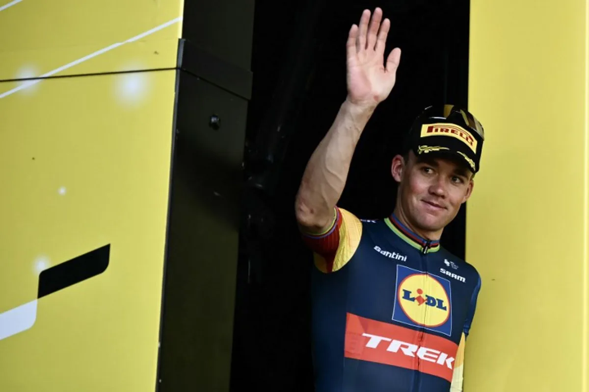 Lidl - Trek team's Danish rider Mads Pedersen celebrates with the most competitive rider's award on the podium after the 6th stage of the 111th edition of the Tour de France cycling race, 163,5 km between Macon and Dijon, on July 4, 2024.  Marco BERTORELLO / AFP