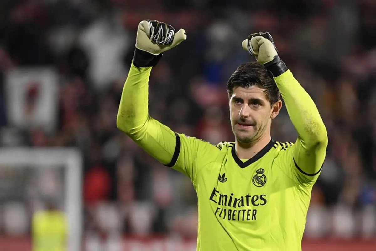 Real Madrid's Belgian goalkeeper #01 Thibaut Courtois celebrates at the end of the Spanish league football match between Girona FC and Real Madrid CF at the Montilivi stadium in Girona on December 7, 2024.  Josep LAGO / AFP