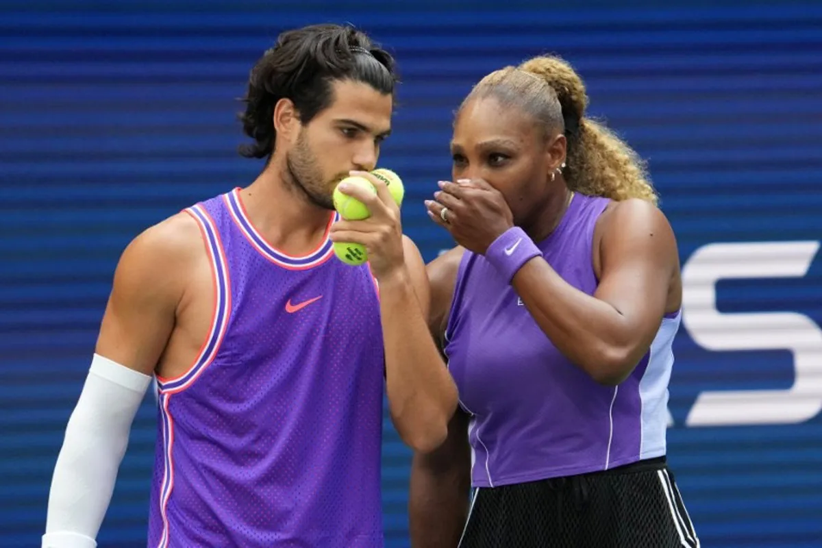 Spain's Carlos Alcaraz and USA's Serena Williams confer during Fan Week as part of the 2026 US Open tennis tournament at the USTA Billie Jean King National Tennis Center in New York, on August 25, 2026.  TIMOTHY A. CLARY / AFP