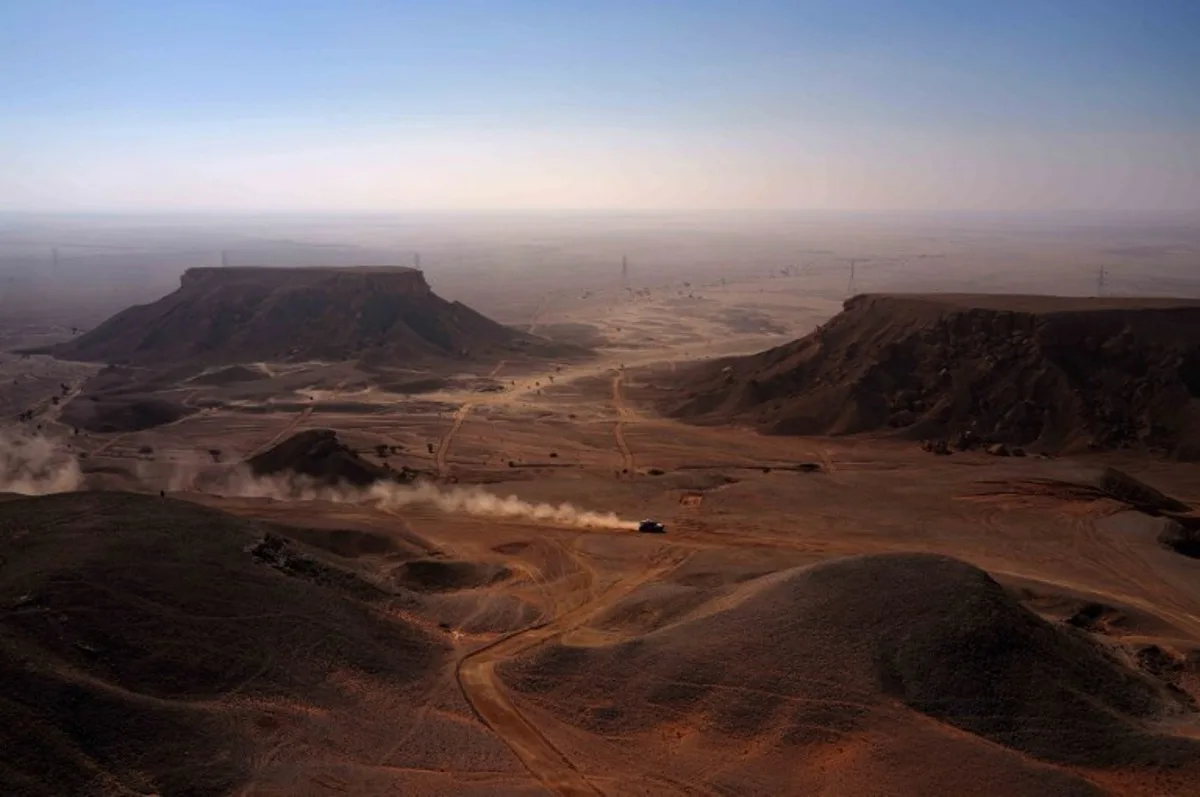 Drivers compete in the Stage 9 of the Dakar Rally 2025, between Riyadh and Haradh, Saudi Arabia, on January 14, 2025.  Valery HACHE / AFP