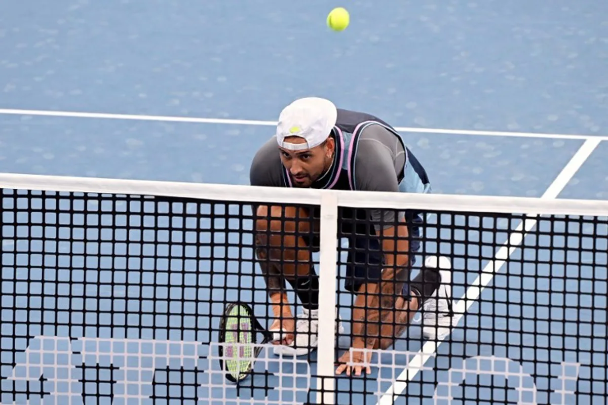 Nick Kyrgios of Australia plays a point during his men's doubles match against Michael Venus of New Zealand and Nikola Mektic of Croatia at the Brisbane International tennis tournament in Brisbane on January 1, 2025.  William WEST / AFP