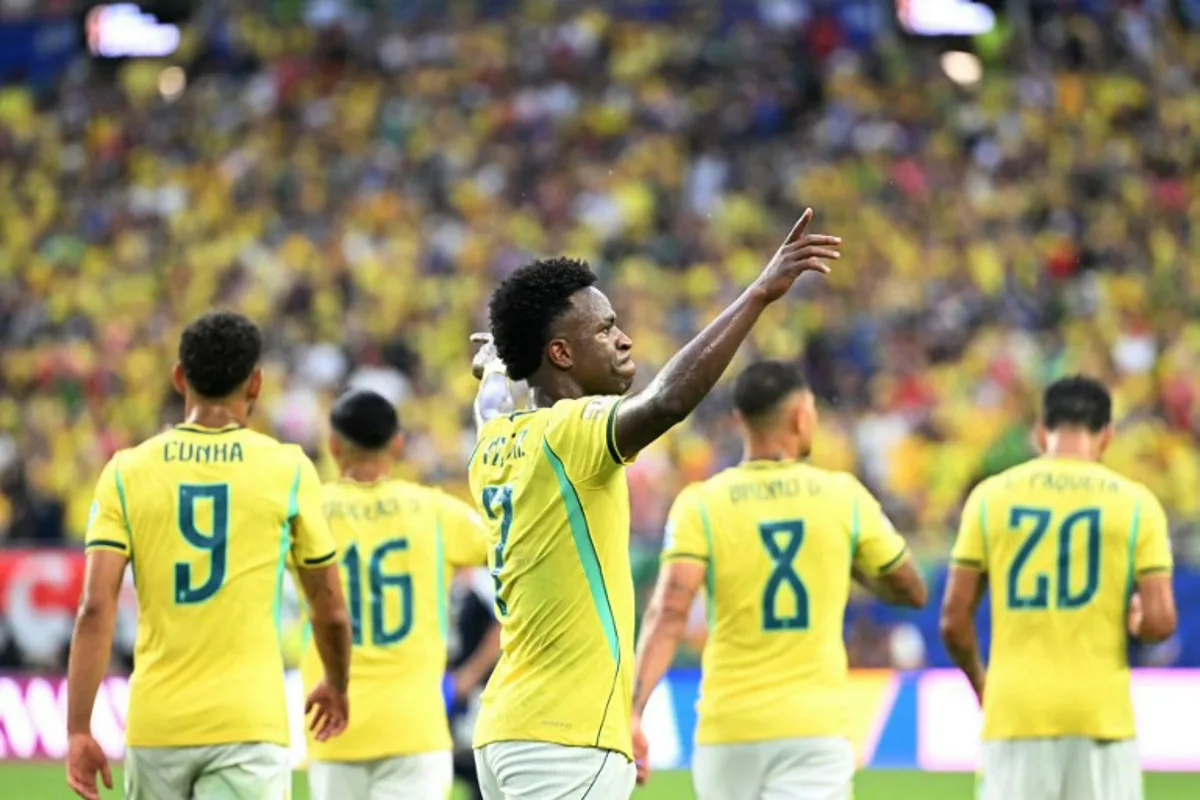 Brazil's forward #07 Vinicius Junior celebrates after scoring his team's second goal during the 2026 World Cup Group C football match between Scotland and Brazil at the Miami Stadium in Miami Gardens on June 24, 2026.   CHANDAN KHANNA / AFP