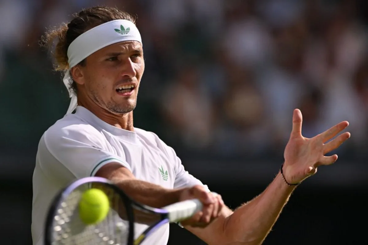 Germany's Alexander Zverev plays a forehand return to France's Arthur Rinderknech during their men's singles first round tennis match on the second day of the 2025 Wimbledon Championships at The All England Lawn Tennis and Croquet Club in Wimbledon, southwest London, on July 1, 2025. Glyn KIRK / AFP