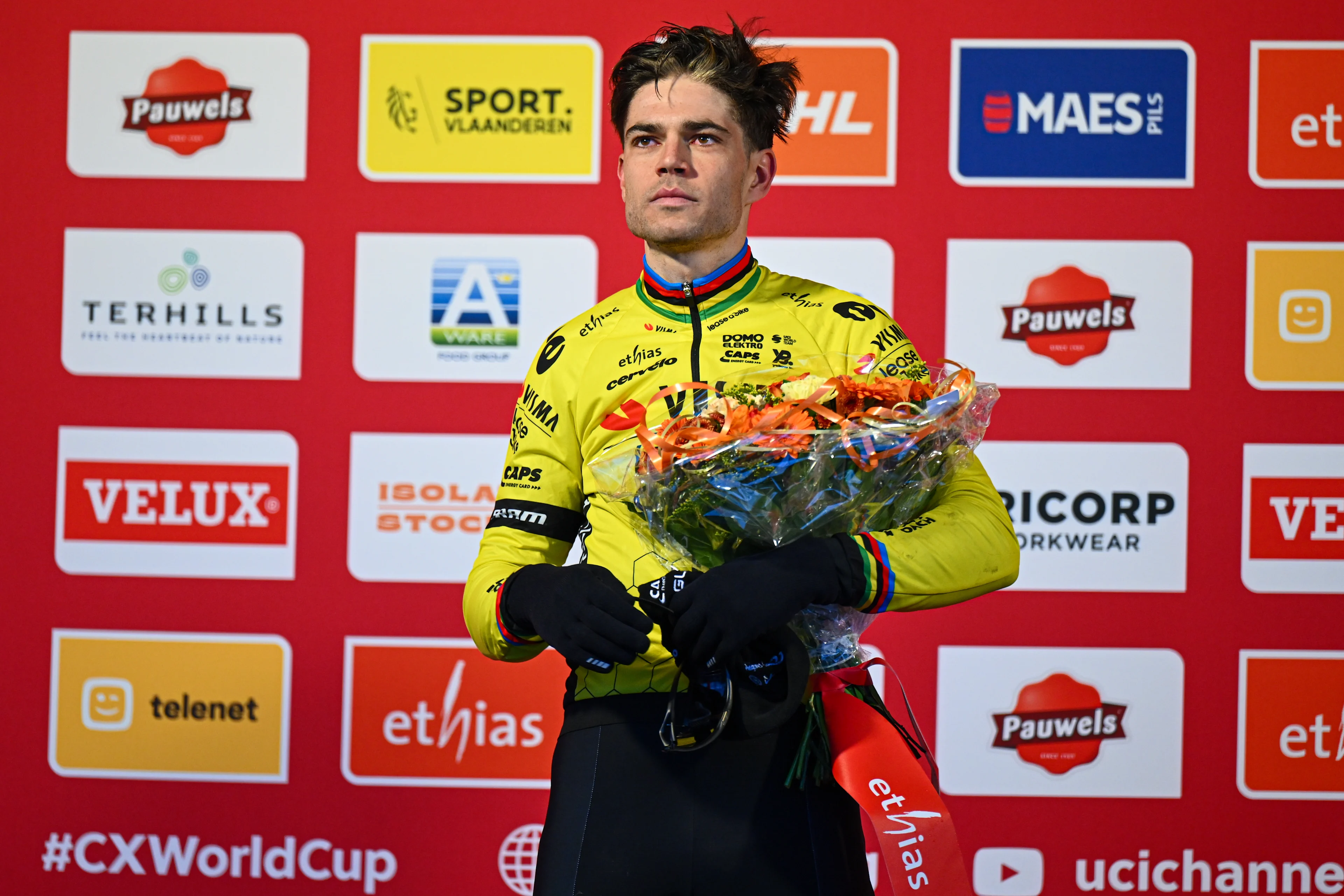 Belgian Wout van Aert pictured on the podium after the men's elite race at the World Cup cyclocross cycling event in Maasmechelen, Belgium, stage 11 (out of 12) of the UCI World Cup cyclocross competition, Saturday 25 January 2025. BELGA PHOTO LUC CLAESSEN