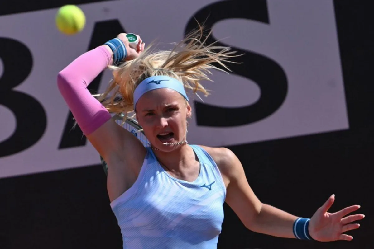 Slovakia's Rebecca Sramkova returns to Latvia's Jelena Ostapenko during the Women's WTA Rome Open tennis tournament at Foro Italico in Rome on May 13, 2024.   Andreas SOLARO / AFP