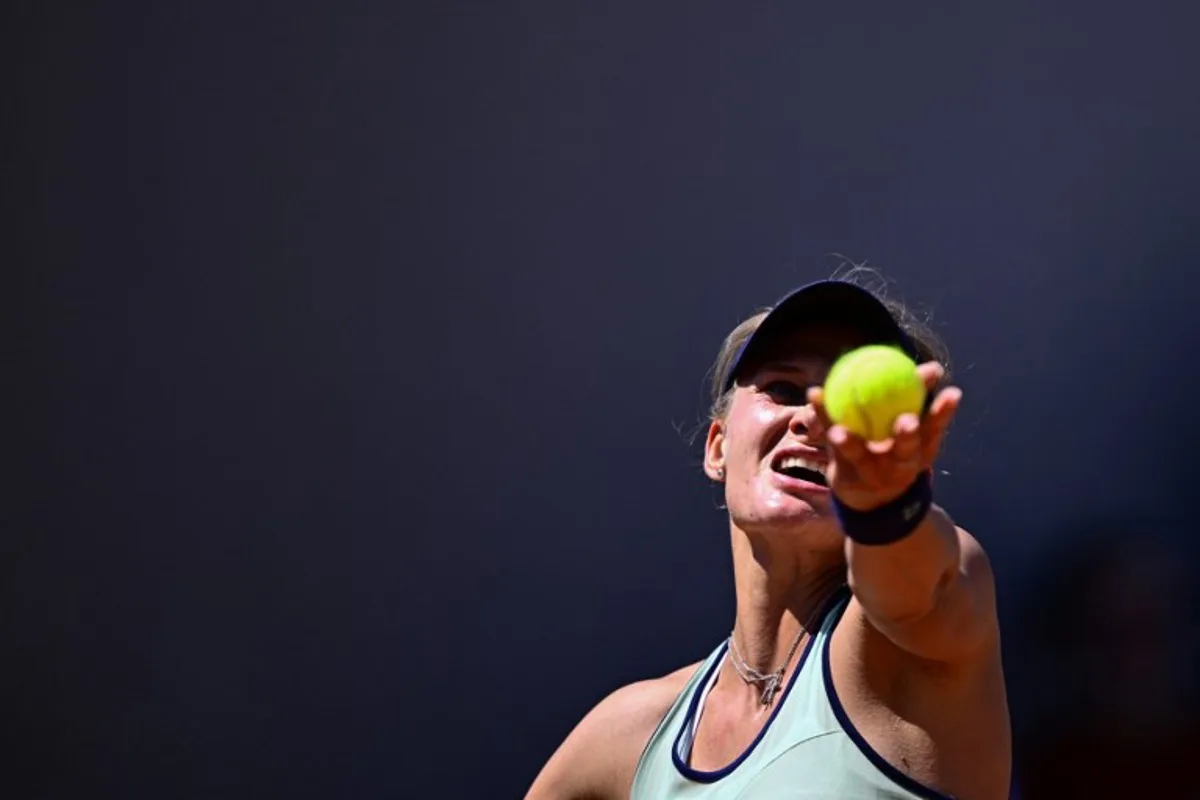 Ukraine's Dayana Yastremska serves to Russia's Liudmila Samsonova during their women's singles match on day 6 of the French Open tennis tournament at the Roland-Garros Complex in Paris on May 30, 2025. JULIEN DE ROSA / AFP